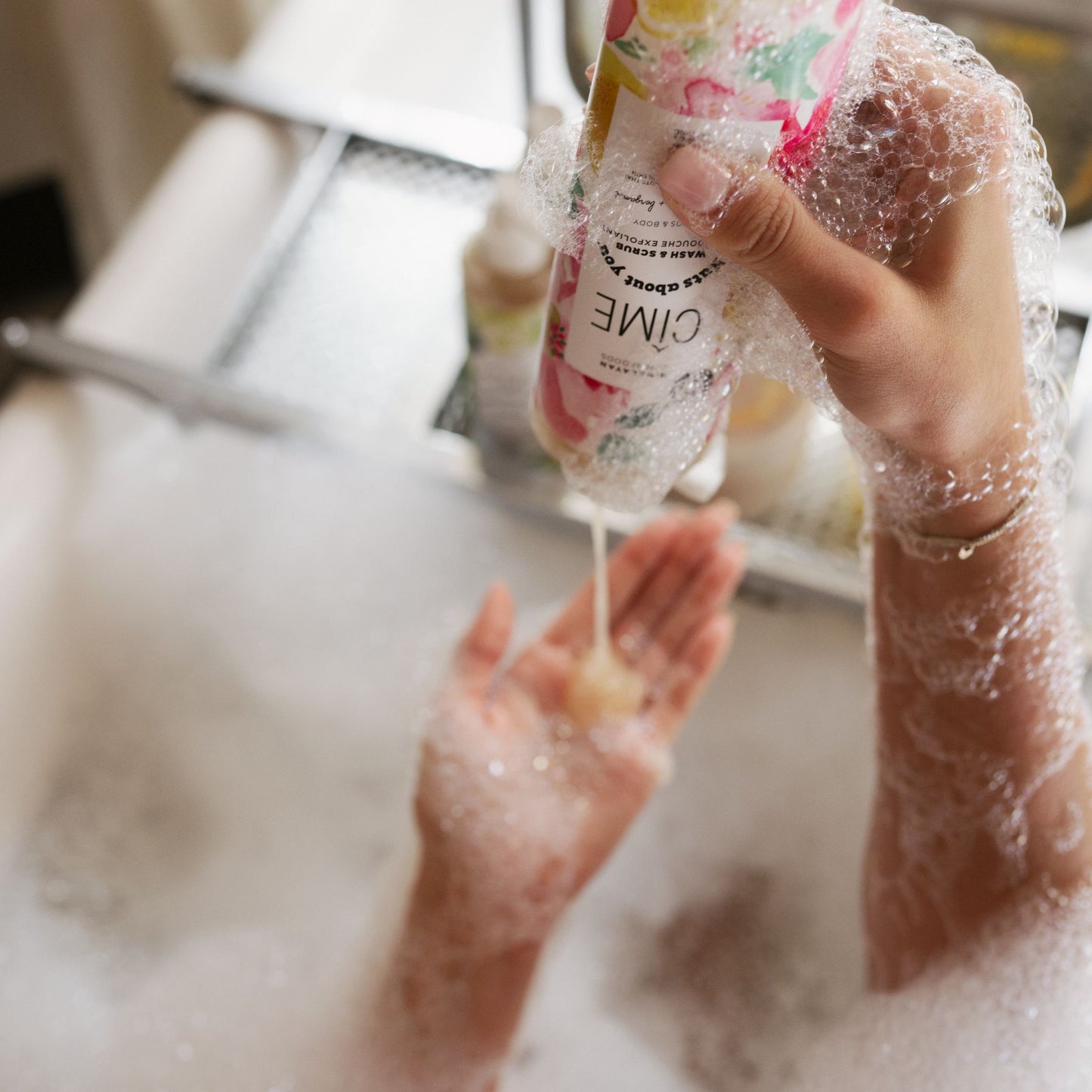 Natural body scrub and wash in use in bath