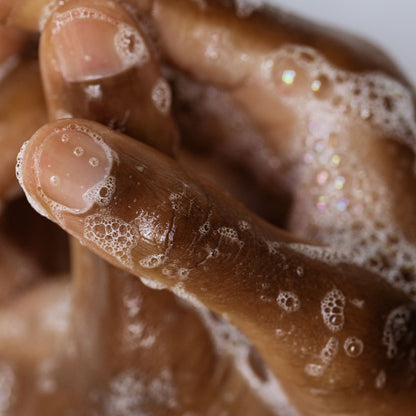 Hands feeling the soft and foamy soap