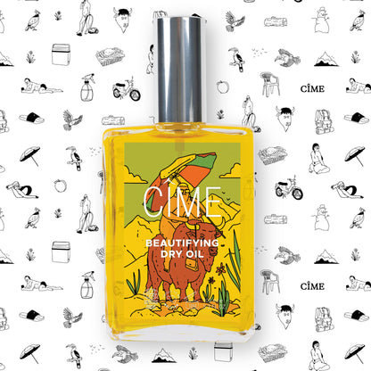 CÎME Beautifying Dry Oil met MAT-cadeaupapier op de achtergrond